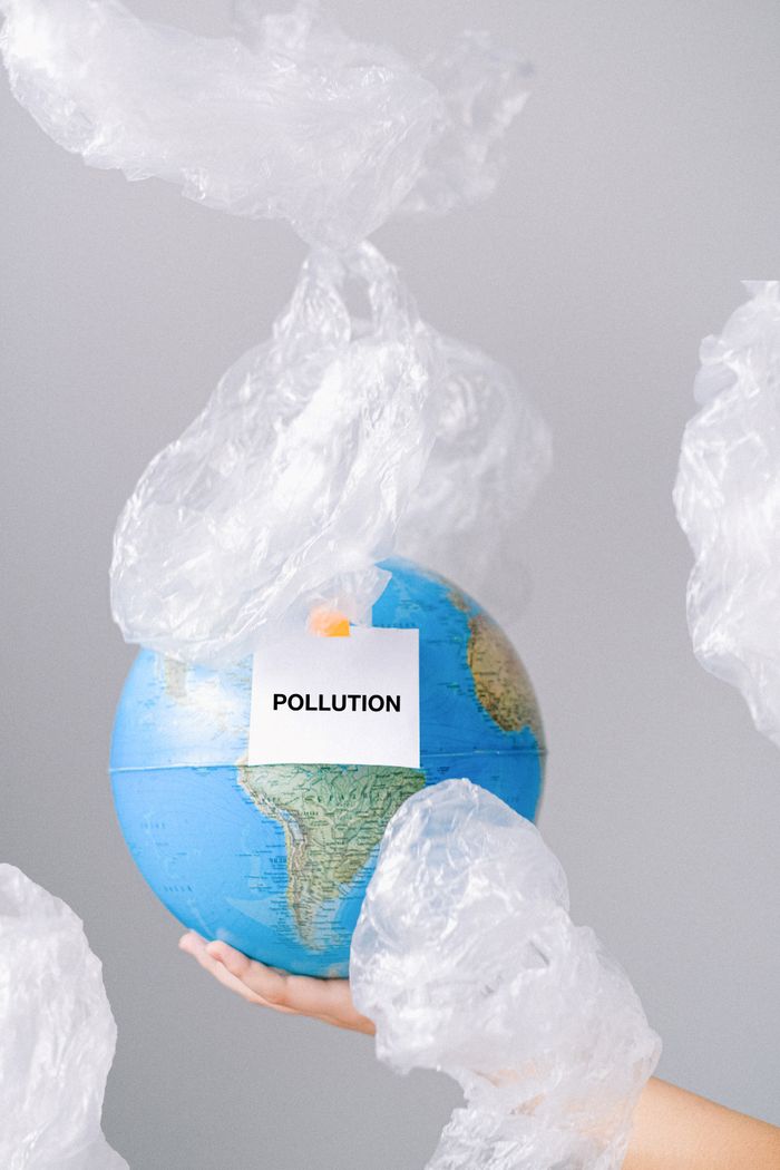 Conceptual image of Earth in plastic pollution, highlighting environmental issues.